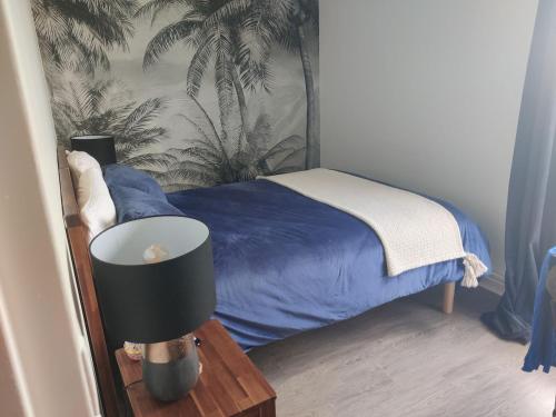 Ένα ή περισσότερα κρεβάτια σε δωμάτιο στο Le Refuge de Céline - Proche Paris-La Défense