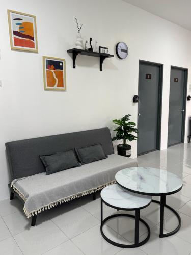 a living room with a couch and a table at Chill Inn Homestay in Jerantut