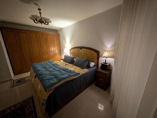 Ένα ή περισσότερα κρεβάτια σε δωμάτιο στο Tango home stay