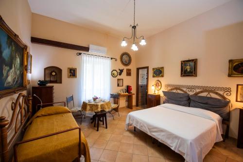 a bedroom with a bed and a table at bed and breakfast Grotta dell'Olio in Sarno