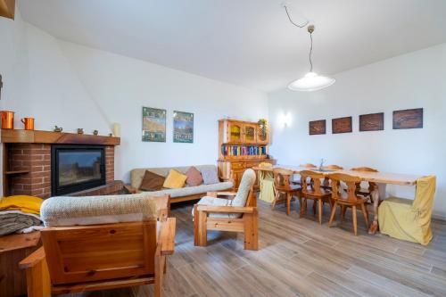 a living room with a couch and a table at Albergo Diffuso Balcone sul Friuli in Clauzetto