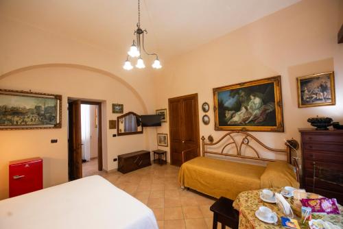 a bedroom with two beds and a dresser at bed and breakfast Grotta dell'Olio in Sarno