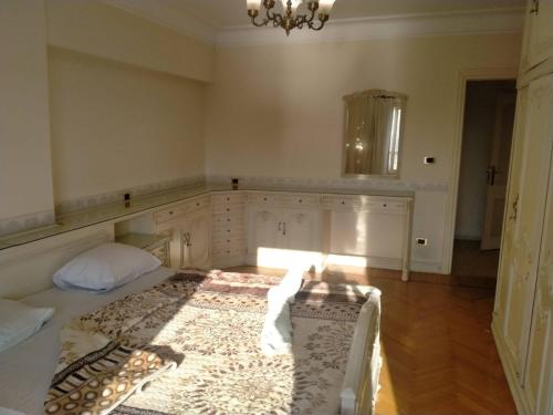 a bedroom with a bed and a rug on the floor at Nile sky hotel and suites in Cairo