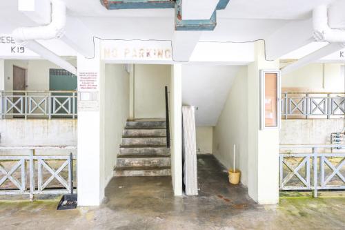 a white building with stairs and a sign that reads no parking at Modern Family Suite in Cameron Highlands Clover Home K2 in Cameron Highlands