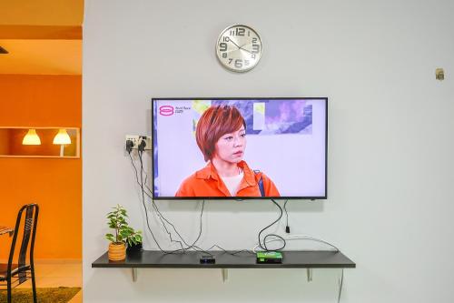 a flat screen tv hanging on a wall at Modern Family Suite in Cameron Highlands Clover Home K2 in Cameron Highlands