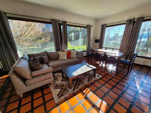 a living room with a couch and a table at Tu refugio en Bariloche in San Carlos de Bariloche