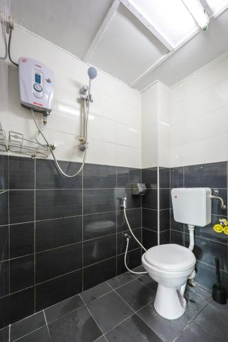 a bathroom with a toilet and a shower at Modern Family Suite in Cameron Highlands Clover Home K2 in Cameron Highlands