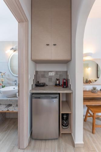 a kitchen with a counter and a sink in a room at SKYROS AVRA Residences in Skiros