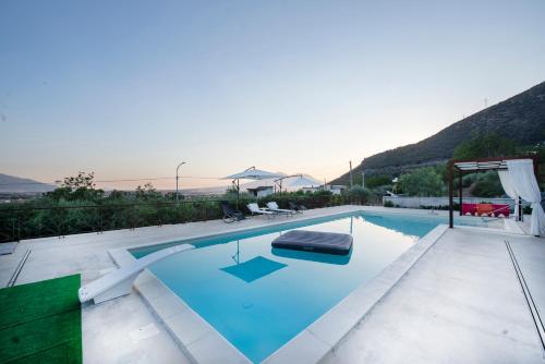 a large swimming pool with a chair at bed and breakfast Grotta dell'Olio in Sarno