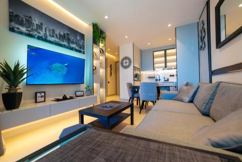 a living room with a couch and a table at Bellemond Hotel & Residences in Budva