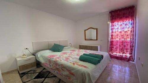 Ένα ή περισσότερα κρεβάτια σε δωμάτιο στο Apt ManRey 1B - Ambar