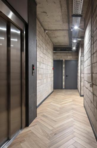 an empty hallway with a metal door in a building at AREA Hotel Yerevan in Yerevan