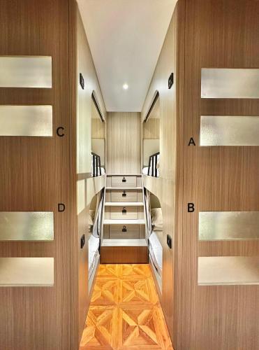 a room with wooden walls and wooden floors and shelves at Yuanjili International Youth Hostel in Qingdao