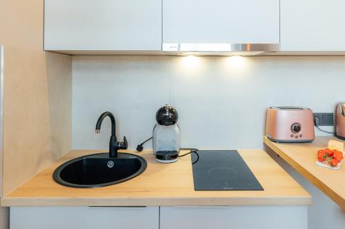 Kuchyň nebo kuchyňský kout v ubytování Aparthotel Aurum