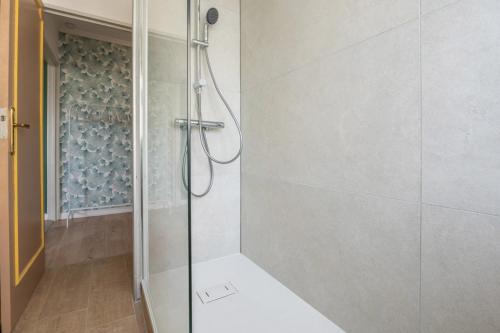 a shower with a glass door in a bathroom at Super Studio on Boulevard Mulhouse Hyper Centre in Mulhouse