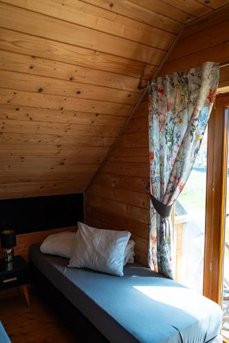 Cama o camas de una habitación en Domek Pod Limbami II