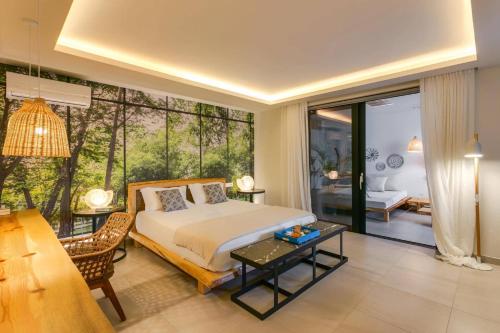 A bed or beds in a room at Villa Mariba Blue by Villa Plus