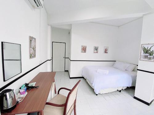 Ένα ή περισσότερα κρεβάτια σε δωμάτιο στο GO INN Hua Lamphong - โกอินน์ หัวลำโพง