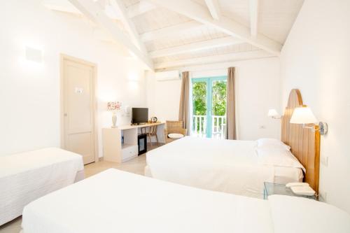Postel nebo postele na pokoji v ubytování Park Hotel Asinara