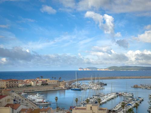 a group of boats docked in a harbor on the water at Hotel Catalunya in Alghero