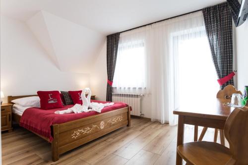 Postel nebo postele na pokoji v ubytování U Gawlaka - Noclegi z Jacuzzi i widokiem na Tatry
