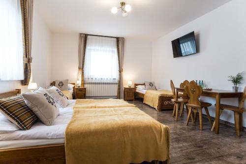 Postel nebo postele na pokoji v ubytování U Gawlaka - Noclegi z Jacuzzi i widokiem na Tatry