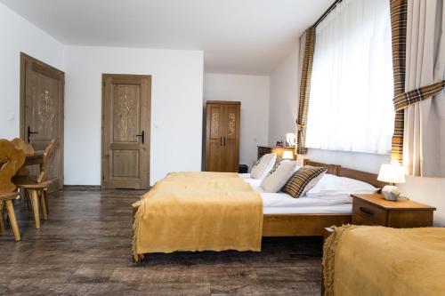 Postel nebo postele na pokoji v ubytování U Gawlaka - Noclegi z Jacuzzi i widokiem na Tatry