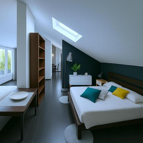 Un dormitorio con una cama grande y una mesa. en Borgo d'Oro Loft, en Bérgamo