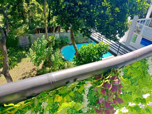 an overhead view of a swimming pool in a garden at Skylodge B&B - Bali Jungle Retreat with Fine Dining & Eco Pool in Bukti
