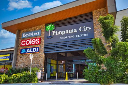 a store front of a shopping center at Cozy Stay 4BR Townhouse in Pimpama