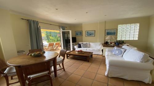 a living room with a couch and a table at La Molina Casa in Calera