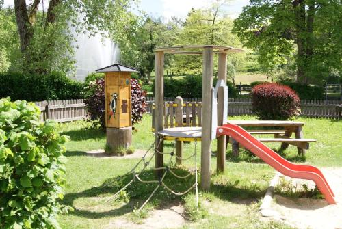 a park with a playground with a slide at Hotel Braunlage in Braunlage