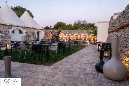 Un restaurante o sitio para comer en MASSERIA OSHA ex QUIS UT DEUS