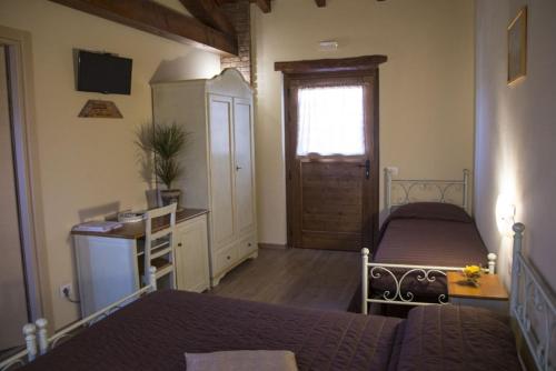 TV a/nebo společenská místnost v ubytování Agriturismo L'Antico Sapore