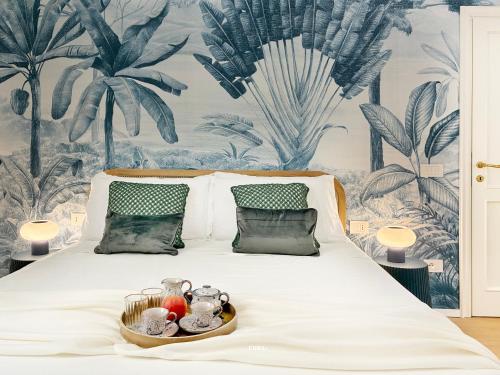 a bed with a tray of food on it at Villa Radici in Teramo