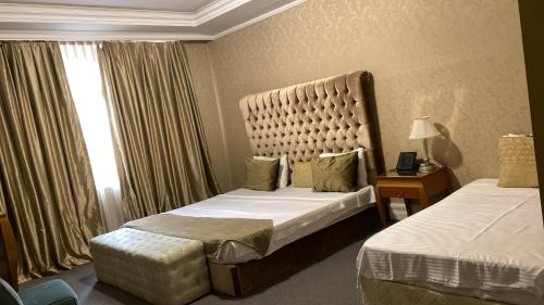 Ein Bett oder Betten in einem Zimmer der Unterkunft Lake view Palace Hotel