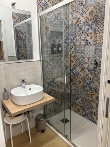 a bathroom with a sink and a shower at Le tre Vele in La Spezia