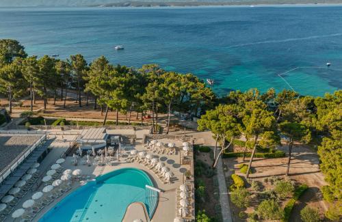 an aerial view of a resort with a swimming pool and the ocean at Bluesun Hotel Elaphusa in Bol
