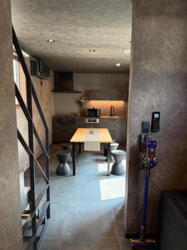 a large kitchen with a table and toilets in it at EKVOLI ROPPONGI TOKYO, Private Hotel in Tokyo