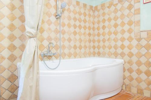a bathroom with a shower and a toilet at swimming pool and private garden, Casa in collina in Barcuzzi