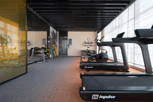 a gym with several treadmills and a treadmill at Hampton by Hilton Guangzhou Baiyun Airport Cultural Tourism City in Guangzhou