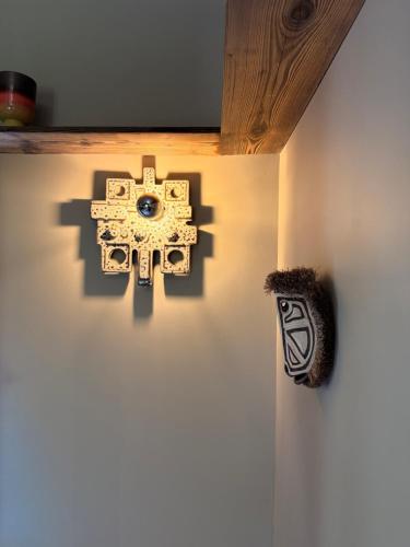 a wall with a mask on the wall at La Maison noire de Fontbelle in Angoulême