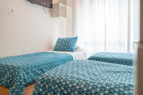Кровать или кровати в номере Life Magenta Gijón
