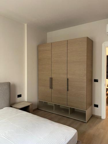 Ένα ή περισσότερα κρεβάτια σε δωμάτιο στο Emera Apartments