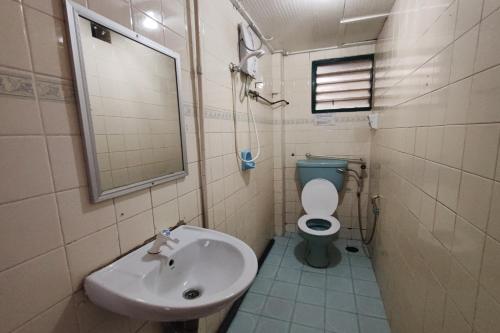 a bathroom with a sink and a toilet at Hotel Check Inn 2 Cameron Highlands in Brinchang