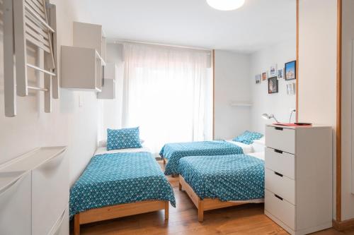 Кровать или кровати в номере Life Magenta Gijón