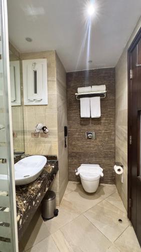 a bathroom with a sink and a toilet at Grand Ocean El Sokhna in Ain Sokhna