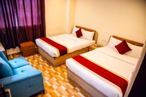 Postel nebo postele na pokoji v ubytování pashupati front hotel