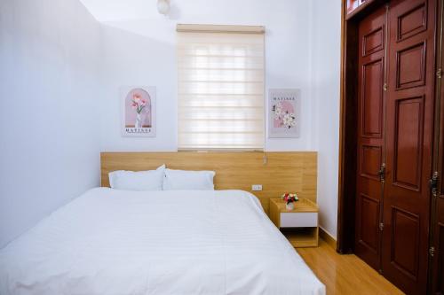 Ένα ή περισσότερα κρεβάτια σε δωμάτιο στο Khánh An Hotel - Mộc Châu