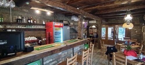a bar in a restaurant with a soda machine at Petrovaradinski Dvor in Petrovaradin